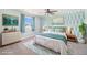 Bright bedroom with stylish wallpaper, ceiling fan, area rug, and modern decor at 1923 Ensenada Ct, Aurora, CO 80011