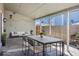 Outdoor covered patio, furnished with table and chairs, and outdoor sofa at 1923 Ensenada Ct, Aurora, CO 80011