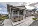 Inviting backyard patio featuring a hot tub and concrete deck, perfect for relaxation at 2905 Morningbird Ln, Castle Rock, CO 80109