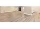 Large basement with neutral walls, light-colored wood-look floors, and access to an exercise area at 2905 Morningbird Ln, Castle Rock, CO 80109