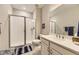 Bright bathroom with white cabinetry, spacious vanity, and a glass-enclosed shower at 2905 Morningbird Ln, Castle Rock, CO 80109
