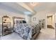 Basement bedroom with a queen-size bed and adjacent bathroom at 2905 Morningbird Ln, Castle Rock, CO 80109