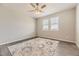 Spacious bedroom featuring wood-look floors and a ceiling fan at 2905 Morningbird Ln, Castle Rock, CO 80109