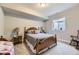 Neutral bedroom featuring a wooden bed frame, carpet floors and minimal decoration at 2905 Morningbird Ln, Castle Rock, CO 80109