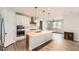 Modern kitchen with a large island and white cabinets at 2905 Morningbird Ln, Castle Rock, CO 80109