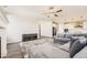 Open concept living room with kitchen views and fireplace at 2905 Morningbird Ln, Castle Rock, CO 80109