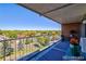 Spacious balcony overlooking tree-lined street and cityscape at 4800 E Hale Pkwy # 709N, Denver, CO 80220