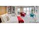 Cozy bedroom with built-in shelving and red accents at 4800 E Hale Pkwy # 709N, Denver, CO 80220