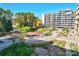 Complex courtyard with landscaping, walkways, and a covered patio area at 4800 E Hale Pkwy # 709N, Denver, CO 80220