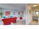 Open living room and bedroom with teal accent chairs at 4800 E Hale Pkwy # 709N, Denver, CO 80220