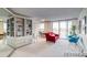 Bright living room with city views and a red couch at 4800 E Hale Pkwy # 709N, Denver, CO 80220