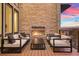 Outdoor deck with fireplace and comfortable seating at 1196 Lost Elk Loop, Castle Rock, CO 80108