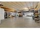 Unfinished basement with exposed ceiling, concrete floor, and water heater at 22166 E Chestnut Pl, Aurora, CO 80016