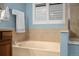 Bathroom with soaking tub and tiled backsplash at 22166 E Chestnut Pl, Aurora, CO 80016