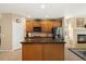 Bright kitchen featuring wooden cabinets, stainless appliances, and granite countertops for meal preparation at 22166 E Chestnut Pl, Aurora, CO 80016