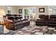 Comfortable living room with leather furniture, and an area rug at 22166 E Chestnut Pl, Aurora, CO 80016
