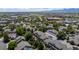 Scenic aerial view of a residential community with lush greenery, mountain backdrop, and well-maintained homes at 584 Ridgeview Dr, Louisville, CO 80027