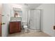 Well-lit bathroom with a stand-up shower, vanity, and tile floors, ideal for easy cleaning and maintenance at 584 Ridgeview Dr, Louisville, CO 80027
