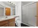 Bathroom featuring a glass-enclosed shower and wood vanity at 584 Ridgeview Dr, Louisville, CO 80027