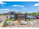 Entrance to Coal Creek Golf Course with a sign and well-maintained landscaping, leading to The Grill restaurant at 584 Ridgeview Dr, Louisville, CO 80027