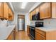 Well-lit kitchen with stainless steel appliances and ample cabinet space at 584 Ridgeview Dr, Louisville, CO 80027