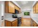 Open kitchen with wood cabinets and hardwood floors at 584 Ridgeview Dr, Louisville, CO 80027