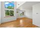 Spacious living room featuring high ceilings, large windows, and gleaming hardwood floors at 584 Ridgeview Dr, Louisville, CO 80027