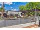 Stylish outdoor patio at /pôr/ Wine House with a wooden fence, comfortable seating, and inviting ambiance at 584 Ridgeview Dr, Louisville, CO 80027