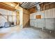 Unfinished basement with exposed beams, concrete walls, and a laundry area at 2786 E 118Th Cir, Thornton, CO 80233