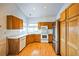Kitchen with wood cabinets, stainless steel appliances, and wood flooring at 2786 E 118Th Cir, Thornton, CO 80233