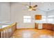 Kitchen with light wood cabinets, hardwood floor, and breakfast bar at 2786 E 118Th Cir, Thornton, CO 80233