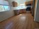 Open kitchen with stainless steel appliances and natural wood cabinets at 2786 E 118Th Cir, Thornton, CO 80233