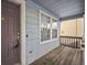 Front porch with wooden floor, and a dark brown door at 2786 E 118Th Cir, Thornton, CO 80233