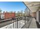 Balcony overlooking neighborhood with wrought iron railing at 100 S Clarkson St # 304, Denver, CO 80209