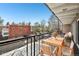 Inviting balcony space with outdoor dining set and neighborhood views for relaxing or entertaining guests at 100 S Clarkson St # 304, Denver, CO 80209