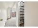 Bedroom with carpet and shelves, and sliding glass door to balcony at 100 S Clarkson St # 304, Denver, CO 80209