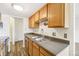 Kitchen with stainless steel sink and faucet, and wood cabinetry at 100 S Clarkson St # 304, Denver, CO 80209