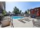 Community pool area with plenty of lounge chairs and tables available for residents to bask in the sun at 100 S Clarkson St # 304, Denver, CO 80209