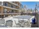 Apartment complex pool and community area seating at 100 S Clarkson St # 304, Denver, CO 80209