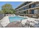 A beautifully maintained community pool and lounge space with plenty of comfortable seating and shade at 100 S Clarkson St # 304, Denver, CO 80209