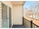 Private balcony overlooking a wooded area at 6021 Yarrow St # B12, Arvada, CO 80004