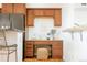 Kitchen desk area with wood cabinets and granite countertops at 6021 Yarrow St # B12, Arvada, CO 80004