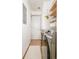 Bright laundry room features washer, dryer, and ample shelving at 6021 Yarrow St # B12, Arvada, CO 80004