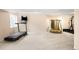 Finished basement with exercise equipment and plenty of open space at 5861 Mt Shadows Blvd, Firestone, CO 80504