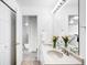 Bright bathroom featuring a double sink vanity and neutral-toned countertops, offering both style and functionality at 5861 Mt Shadows Blvd, Firestone, CO 80504