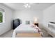Clean bedroom with lots of light, featuring a ceiling fan and modern furniture at 5861 Mt Shadows Blvd, Firestone, CO 80504