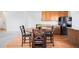 Dining area features wood floors and counter seating at 5861 Mt Shadows Blvd, Firestone, CO 80504