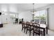Open dining room featuring a wooden table, decorative chairs, and lots of natural light at 5861 Mt Shadows Blvd, Firestone, CO 80504