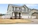 Charming two-story home with a three-car garage and manicured landscaping at 5861 Mt Shadows Blvd, Firestone, CO 80504