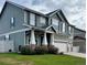 Charming home featuring a well-manicured lawn, two-car garage, and inviting front porch at 5861 Mt Shadows Blvd, Firestone, CO 80504